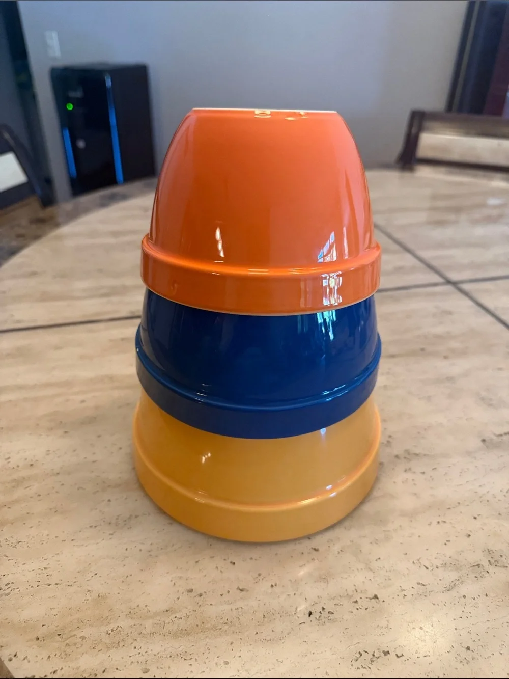 Crate&Barrel Stackable Ceramic Mixing Bowls in Yellow, Blue, and Orange